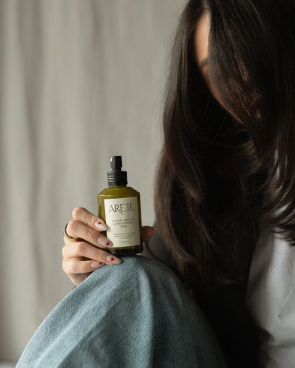 Powered by a modern alchemy of transformative botanicals and nourishing actives, ARETÉ’s Lunar Leave-In Conditioning Mist is an luxurious treatment milk designed to replenish softness, calm frizz, balance porosity, and restore manageability to dry or depleted strands.