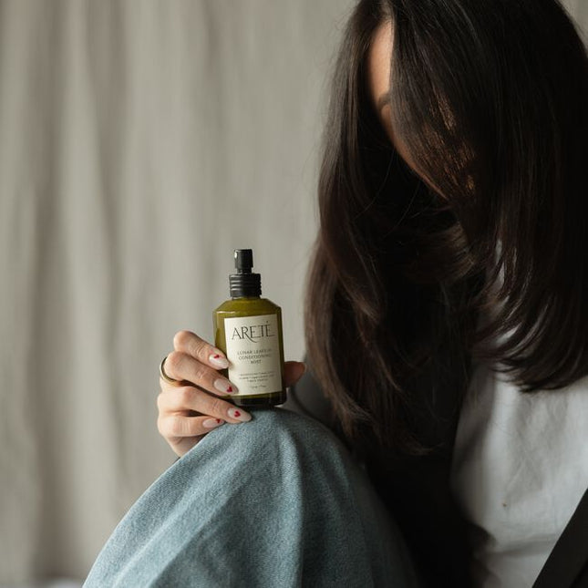 Powered by a modern alchemy of transformative botanicals and nourishing actives, ARETÉ’s Lunar Leave-In Conditioning Mist is an luxurious treatment milk designed to replenish softness, calm frizz, balance porosity, and restore manageability to dry or depleted strands.
