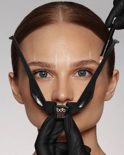 When shaping eyebrows, "one-size-fits-all" stencils rarely produce desired results. The Brow Buddy Tool has revolutionized the brow shaping process by identifying the most flattering start, arch &amp; end based on the unique facial structure of each client.