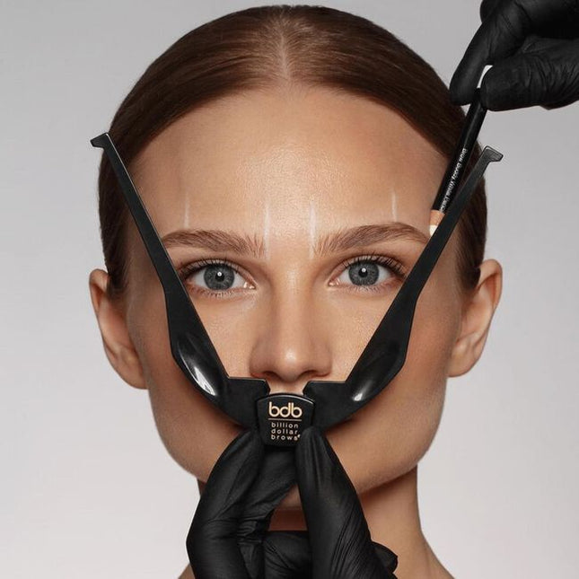 When shaping eyebrows, "one-size-fits-all" stencils rarely produce desired results. The Brow Buddy Tool has revolutionized the brow shaping process by identifying the most flattering start, arch &amp; end based on the unique facial structure of each client.