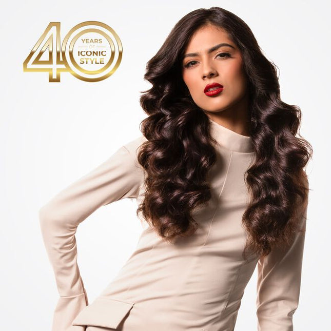 Celebrating 40 years of CHI innovation, this 1.25” Curling Iron is a tribute to CHI's Ruby Anniversary—a mile stone representing passion, strength, and lasting beauty. From CHI's ground breaking ceramic roots to the evolution of CHI LAVA Advanced Technology, this tool reflects four decades of progress. The fusion of CHI Ceramic and Volcanic Lava delivers consistent, even heat for smooth, voluminous curls with enhanced shine—honoring the past while styling the future.