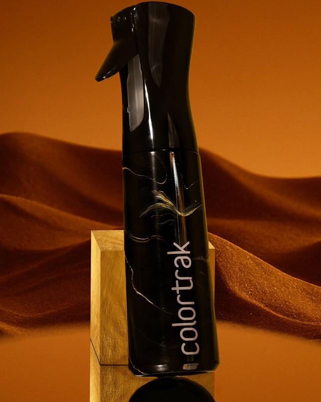 Where precision meets style, the Midnight Lux Spray Bottle elevates your styling game. Designed in a sleek, deep hue, it adds a touch of luxe to your station. The ultra-fine mist ensures even distribution, giving you complete control for flawless results every time. With a comfortable grip and consistent spray, every spritz feels like magic—because your craft deserves more than just a bottle.