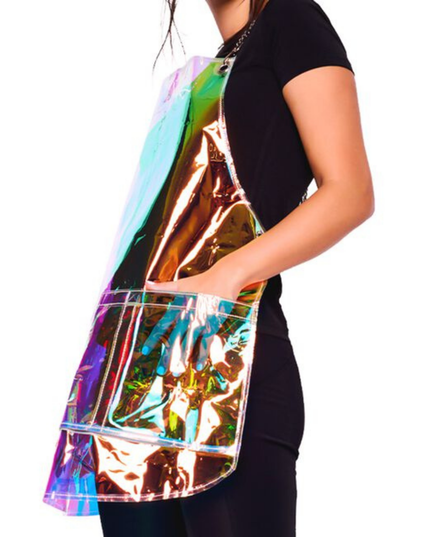 Experience the new and improved Nothing to Hide Vinyl Apron, designed to prevent stains in style. This fashionable and lightweight apron is chemical and waterproof, featuring adjustable chains for a one-size-fits-most fit. With three zippered pockets for easy hair removal and antimicrobial, BPA-free material, it's easy to clean and sanitize. Personalize your look with removable vinyl cling stickers and enjoy a perfect blend of functionality and fashion in your salon.