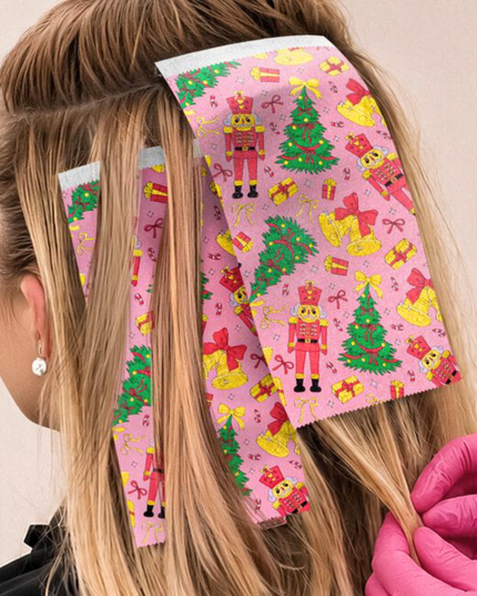 Bring a little holiday magic to the chair with Nutcracker Parade, a festive foil inspired by classic nutcrackers and Christmas cheer. Sweet, playful, and full of storybook charm, it pairs seasonal style with the reliable grip and control you need for flawless color work. From bright winter blondes to merry dimensional blends, this foil keeps sections secure and results polished while spreading festive joy. Cute, classic, and ready to lead the parade through the holidays.