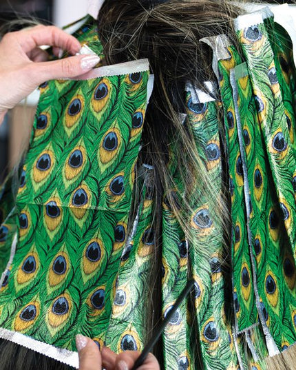 Step into the spotlight with Peacock, a foil made to show off. Inspired by the fiercest feathers in nature, this design brings rich jewel tones and graceful detail to every service. With flawless grip and smooth saturation, each sheet helps you create color that struts with confidence and shines with unapologetic glam. From brilliant blondes to dimensional brunettes, every highlight becomes a statement worth noticing. Bold, beautiful, and born to stand out, this is Peacock.