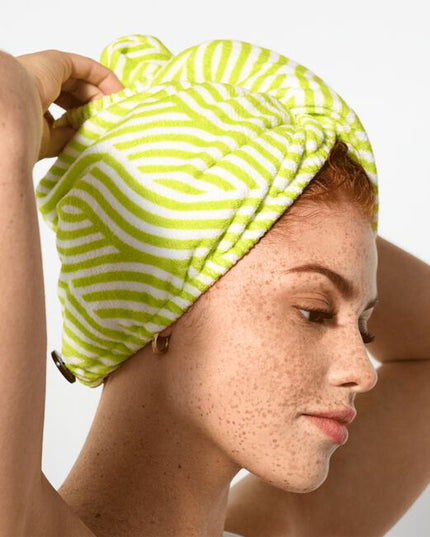 When you're short on time and long on tasks, this towel wrap is your new bestie. The soft, microfiber fabric helps dry your curls without roughing them up like a terrycloth towel tends to do. Its roomy crescent shape is great for all curl types and securely fastens so you can do other things while your curls dry. Twist on, move on!