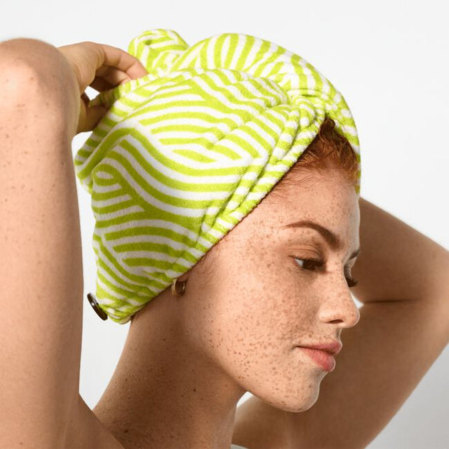 When you're short on time and long on tasks, this towel wrap is your new bestie. The soft, microfiber fabric helps dry your curls without roughing them up like a terrycloth towel tends to do. Its roomy crescent shape is great for all curl types and securely fastens so you can do other things while your curls dry. Twist on, move on!
