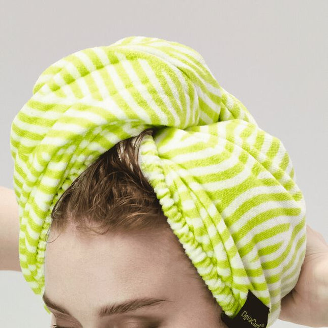 When you're short on time and long on tasks, this towel wrap is your new bestie. The soft, microfiber fabric helps dry your curls without roughing them up like a terrycloth towel tends to do. Its roomy crescent shape is great for all curl types and securely fastens so you can do other things while your curls dry. Twist on, move on!