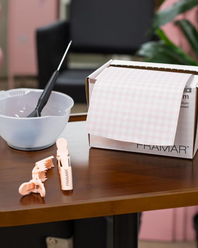 Add a touch of charm to your color services with the Framar Pink Gingham Embossed Foil Roll. Designed for professional stylists, this high-performance foil combines a no-slip embossed texture with a trendy gingham print—giving you both precision and personality behind the chair.