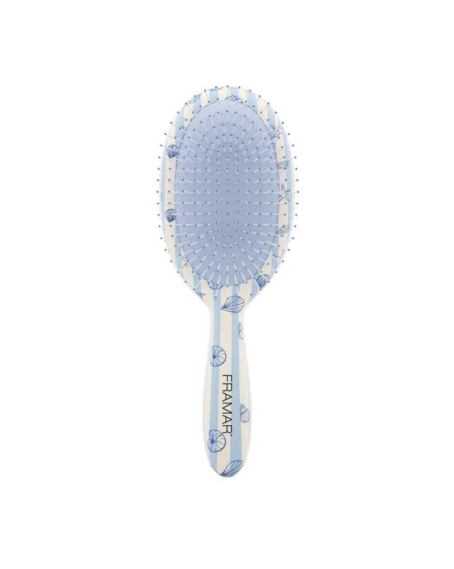 Tangle-free, stress-free, and serving beachy vibes. The Framar Beach Bum Detangle Brush glides through knots with ease thanks to its flexible bristles—perfect for gentle, damage-free detangling on all hair types.