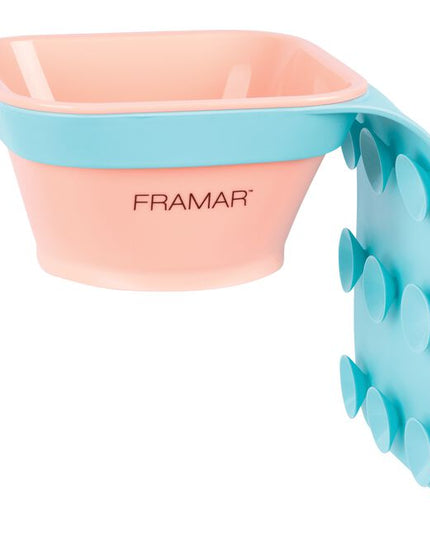 The days of messy toning applications are officially over! The Framar Toning Tub is designed to attach directly to any shampoo bowl, taking the mess out of toning. Simply secure the suction cups in place on the outside or inside of your shampoo bowl, prepare the toner at your color bar, then place the bowl of toner directly into the tub sleeve. From here you can apply your toner just inches from the clients head, saving waste, mess, and time!