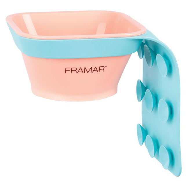 The days of messy toning applications are officially over! The Framar Toning Tub is designed to attach directly to any shampoo bowl, taking the mess out of toning. Simply secure the suction cups in place on the outside or inside of your shampoo bowl, prepare the toner at your color bar, then place the bowl of toner directly into the tub sleeve. From here you can apply your toner just inches from the clients head, saving waste, mess, and time!