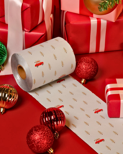 Inspired by nostalgic holiday scenes and timeless winter charm, this foil roll features evergreen trees and iconic red trucks for a warm, vintage Christmas feel.
