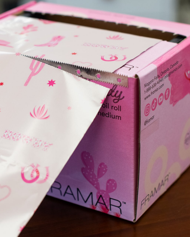 Bring efficiency and creativity to every color service with the Framar Howdy Smooth Roll Foil. Designed for busy salons and stylists who want full control, this extra-long foil roll lets you customize your foil lengths for any technique—while adding a fun, western-inspired vibe to your station.