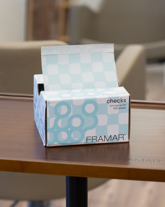 Upgrade your color services with Framar Light Blue Checks Pop Up Foils—designed for speed, precision, and a flawless finish every time. These pre-cut, embossed foils make highlighting and balayage services more efficient, helping stylists work smarter behind the chair while delivering consistent, professional results clients love.