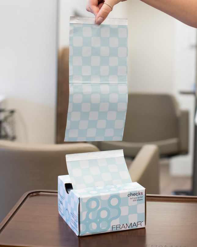 Upgrade your color services with Framar Light Blue Checks Pop Up Foils—designed for speed, precision, and a flawless finish every time. These pre-cut, embossed foils make highlighting and balayage services more efficient, helping stylists work smarter behind the chair while delivering consistent, professional results clients love.