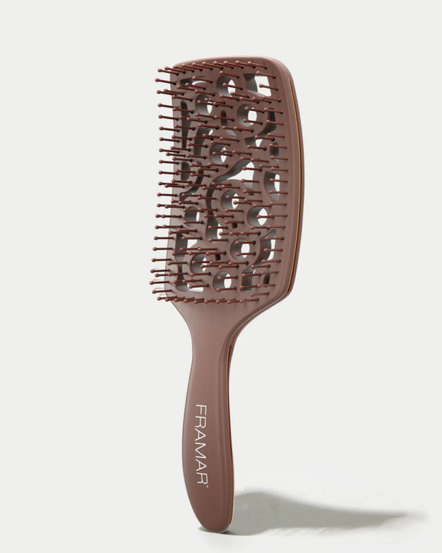 Style and smooth hair in half the time with this aerodynamic detangler designed to hug your scalp and promote airflow.