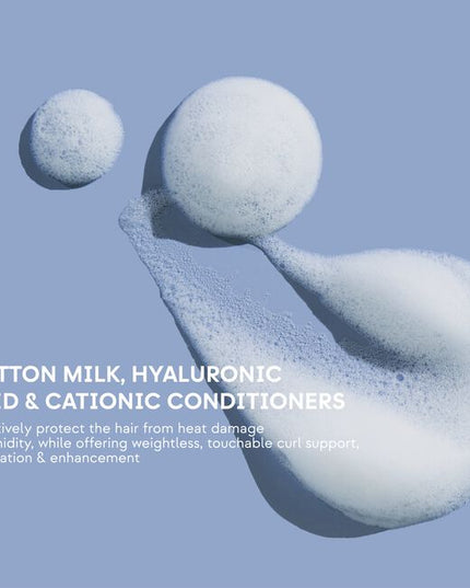 Hydrating, curl-enhancing leave-in for touchable curl support. Lightweight, hydrating formula enhances, restores, and rebuilds curls. Enriched with Cotton Milk, Hyaluronic Acid, and Cationic Conditioners, this weightless leave-in effectively protects the hair from heat damage and humidity. Best suited for dehydrated textures.