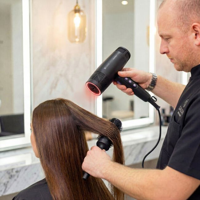 Exhilarating tech meets next-generation performance in the GAMMA+ Xceed Professional Hair Dryer. The high-efficiency digital brushless motor produces up to 120,000 RPM, bringing ultra-concentrated airflow for faster drying, controlled styling, and reduced heat stress. With 12 heat and speed combinations controlled through a sleek LED interface, this hair dryer is the modish answer to every head of hair.