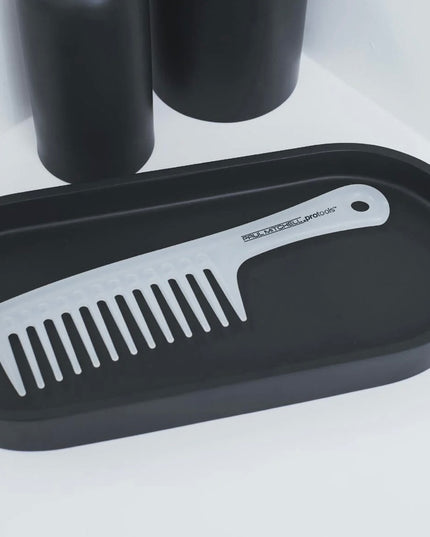 Wide-tooth comb with antimicrobial properties easily detangles wet or dry hair.