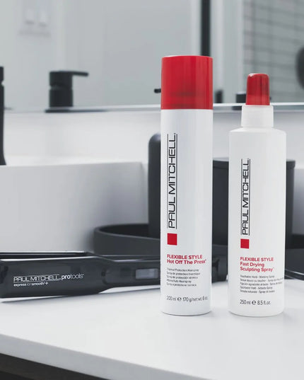 Turn up the heat with this quick-drying thermal protection hairspray that helps protect strands when using curling irons and flat irons. It contains rice hull extract that builds a lightweight barrier between hair and heat styling tools, while wheat proteins boost hair's strength. The flexible-hold, humidity-resistant frizz-fighting formula is the perfect finishing touch for any style—curly or straight.