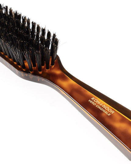 The Koh-I-Noor Rectangular Hair Brush with Natural Bristles is a sleek and sophisticated grooming tool. Hand-crafted in Italy, it features five rows of firm natural bristles that will condition your hair and stimulate your scalp. Part of the Jaspè collection, its faux tortoise handle is designed for comfort. Hand-crafted with the finest materials in Italy.