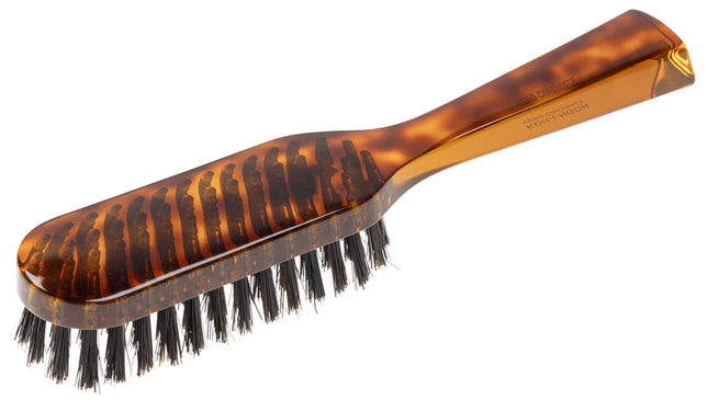The Koh-I-Noor Rectangular Hair Brush with Natural Bristles is a sleek and sophisticated grooming tool. Hand-crafted in Italy, it features five rows of firm natural bristles that will condition your hair and stimulate your scalp. Part of the Jaspè collection, its faux tortoise handle is designed for comfort. Hand-crafted with the finest materials in Italy.