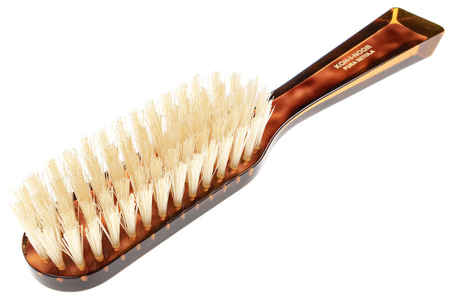 The Koh-I-Noor Rectangular Hair Brush with Natural Bristles is a sleek and sophisticated grooming tool. Hand-crafted in Italy, it features five rows of firm natural bristles that will condition your hair and stimulate your scalp. Part of the Jaspè collection, its faux tortoise handle is designed for comfort. Hand-crafted with the finest materials in Italy.