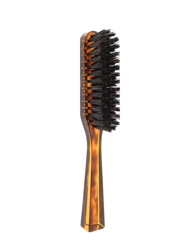 The Koh-I-Noor Rectangular Hair Brush with Natural Bristles is a sleek and sophisticated grooming tool. Hand-crafted in Italy, it features five rows of firm natural bristles that will condition your hair and stimulate your scalp. Part of the Jaspè collection, its faux tortoise handle is designed for comfort. Hand-crafted with the finest materials in Italy.