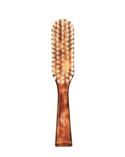 The Koh-I-Noor Rectangular Hair Brush with Natural Bristles is a sleek and sophisticated grooming tool. Hand-crafted in Italy, it features five rows of firm natural bristles that will condition your hair and stimulate your scalp. Part of the Jaspè collection, its faux tortoise handle is designed for comfort. Hand-crafted with the finest materials in Italy.