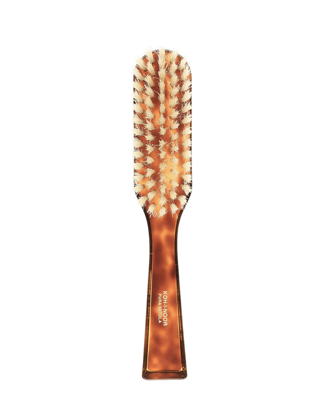 The Koh-I-Noor Rectangular Hair Brush with Natural Bristles is a sleek and sophisticated grooming tool. Hand-crafted in Italy, it features five rows of firm natural bristles that will condition your hair and stimulate your scalp. Part of the Jaspè collection, its faux tortoise handle is designed for comfort. Hand-crafted with the finest materials in Italy.