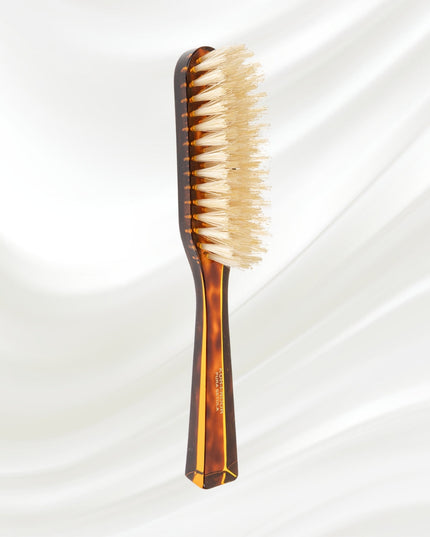 The Koh-I-Noor Rectangular Hair Brush with Natural Bristles is a sleek and sophisticated grooming tool. Hand-crafted in Italy, it features five rows of firm natural bristles that will condition your hair and stimulate your scalp. Part of the Jaspè collection, its faux tortoise handle is designed for comfort. Hand-crafted with the finest materials in Italy.