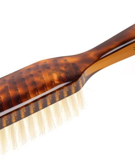 The Koh-I-Noor Rectangular Hair Brush with Natural Bristles is a sleek and sophisticated grooming tool. Hand-crafted in Italy, it features five rows of firm natural bristles that will condition your hair and stimulate your scalp. Part of the Jaspè collection, its faux tortoise handle is designed for comfort. Hand-crafted with the finest materials in Italy.