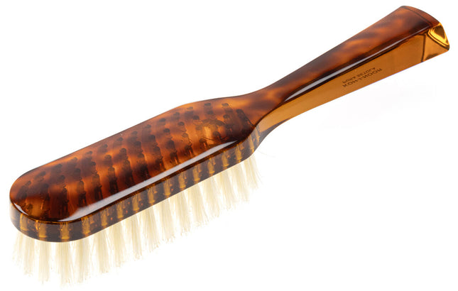 The Koh-I-Noor Rectangular Hair Brush with Natural Bristles is a sleek and sophisticated grooming tool. Hand-crafted in Italy, it features five rows of firm natural bristles that will condition your hair and stimulate your scalp. Part of the Jaspè collection, its faux tortoise handle is designed for comfort. Hand-crafted with the finest materials in Italy.