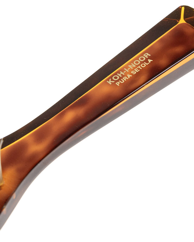 The Koh-I-Noor Rectangular Hair Brush with Natural Bristles is a sleek and sophisticated grooming tool. Hand-crafted in Italy, it features five rows of firm natural bristles that will condition your hair and stimulate your scalp. Part of the Jaspè collection, its faux tortoise handle is designed for comfort. Hand-crafted with the finest materials in Italy.