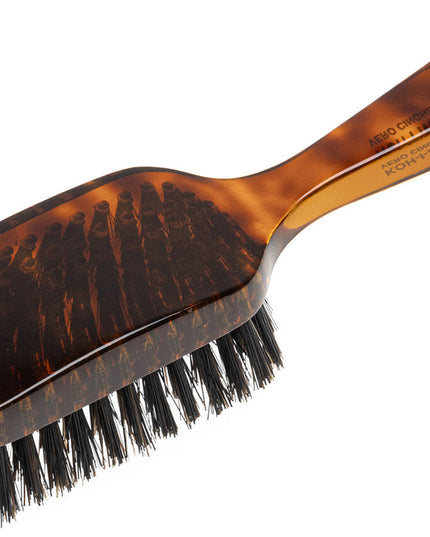 The Koh-I-Noor Wide Rectangular Hair Brush with Natural Bristles is a sophisticated grooming tool. Hand-crafted in Italy, it features firm natural bristles that will condition your hair and stimulate your scalp. It also makes for a terrific beard brush. Part of the Jaspè collection, its faux tortoise handle is designed for comfort. Hand-crafted with the finest materials in Italy.