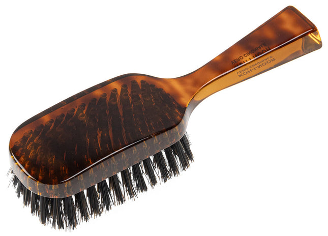 The Koh-I-Noor Wide Rectangular Hair Brush with Natural Bristles is a sophisticated grooming tool. Hand-crafted in Italy, it features firm natural bristles that will condition your hair and stimulate your scalp. It also makes for a terrific beard brush. Part of the Jaspè collection, its faux tortoise handle is designed for comfort. Hand-crafted with the finest materials in Italy.