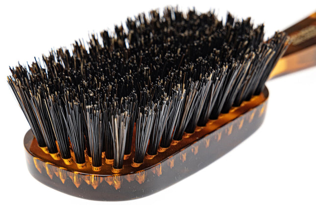 The Koh-I-Noor Wide Rectangular Hair Brush with Natural Bristles is a sophisticated grooming tool. Hand-crafted in Italy, it features firm natural bristles that will condition your hair and stimulate your scalp. It also makes for a terrific beard brush. Part of the Jaspè collection, its faux tortoise handle is designed for comfort. Hand-crafted with the finest materials in Italy.