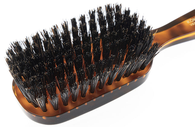 The Koh-I-Noor Wide Rectangular Hair Brush with Natural Bristles is a sophisticated grooming tool. Hand-crafted in Italy, it features firm natural bristles that will condition your hair and stimulate your scalp. It also makes for a terrific beard brush. Part of the Jaspè collection, its faux tortoise handle is designed for comfort. Hand-crafted with the finest materials in Italy.