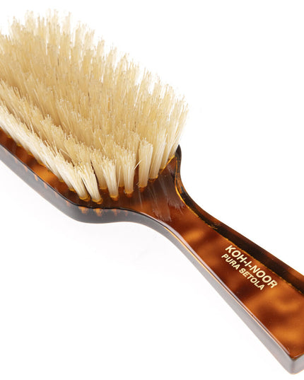 The Koh-I-Noor Wide Rectangular Hair Brush with Natural Bristles is a sophisticated grooming tool. Hand-crafted in Italy, it features firm natural bristles that will condition your hair and stimulate your scalp. It also makes for a terrific beard brush. Part of the Jaspè collection, its faux tortoise handle is designed for comfort. Hand-crafted with the finest materials in Italy.