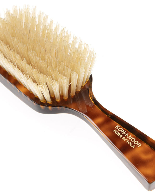 The Koh-I-Noor Wide Rectangular Hair Brush with Natural Bristles is a sophisticated grooming tool. Hand-crafted in Italy, it features firm natural bristles that will condition your hair and stimulate your scalp. It also makes for a terrific beard brush. Part of the Jaspè collection, its faux tortoise handle is designed for comfort. Hand-crafted with the finest materials in Italy.
