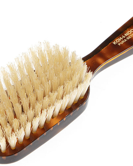 The Koh-I-Noor Wide Rectangular Hair Brush with Natural Bristles is a sophisticated grooming tool. Hand-crafted in Italy, it features firm natural bristles that will condition your hair and stimulate your scalp. It also makes for a terrific beard brush. Part of the Jaspè collection, its faux tortoise handle is designed for comfort. Hand-crafted with the finest materials in Italy.