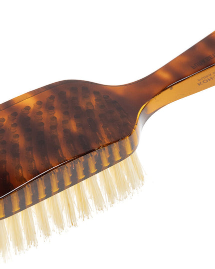 The Koh-I-Noor Wide Rectangular Hair Brush with Natural Bristles is a sophisticated grooming tool. Hand-crafted in Italy, it features firm natural bristles that will condition your hair and stimulate your scalp. It also makes for a terrific beard brush. Part of the Jaspè collection, its faux tortoise handle is designed for comfort. Hand-crafted with the finest materials in Italy.