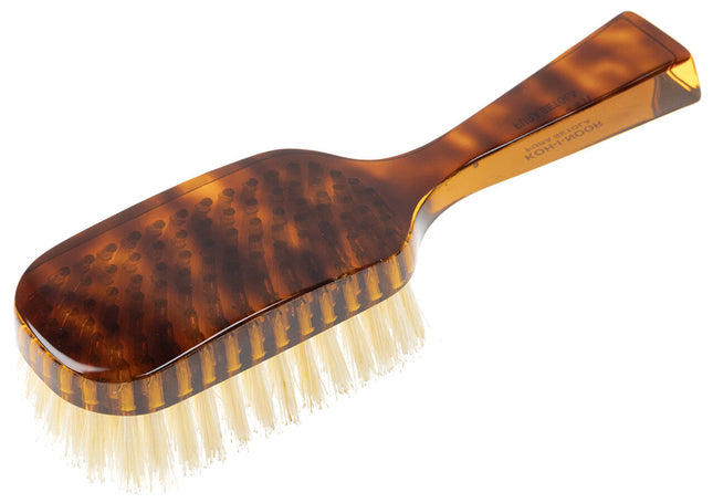 The Koh-I-Noor Wide Rectangular Hair Brush with Natural Bristles is a sophisticated grooming tool. Hand-crafted in Italy, it features firm natural bristles that will condition your hair and stimulate your scalp. It also makes for a terrific beard brush. Part of the Jaspè collection, its faux tortoise handle is designed for comfort. Hand-crafted with the finest materials in Italy.