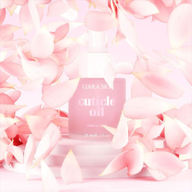 Kiara Sky Rose Scented Cuticle Oil is a professional-grade formula designed to hydrate and condition cuticles during and after salon services. Infused with vitamin E, sweet almond oil, and jojoba oil, this cuticle oil helps replenish moisture lost through chemical or mechanical nail treatments, leaving the nail bed and surrounding skin soft and resilient. Its light rose fragrance provides a clean, refreshing finish without overpowering the service environment. The 0.7 fl oz size is ideal for workstation use