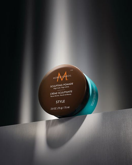 Moroccanoil Sculpting Pomade is a classic pomade that helps create timeless styles with a strong hold. Ideal for pompadours or smooth side parts and perfect for creating trending slicked-back styles on long or short hair. It provides a sleek, highshine finish that adds polish to any hairstyle. Offering an optimal balance of control and flexibility, this hydrating styler keeps your hair in place all day without feeling stiff or greasy.