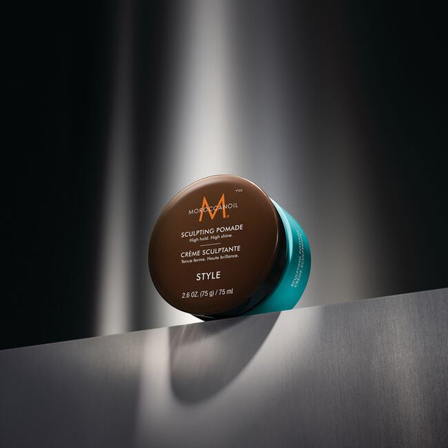 Moroccanoil Sculpting Pomade is a classic pomade that helps create timeless styles with a strong hold. Ideal for pompadours or smooth side parts and perfect for creating trending slicked-back styles on long or short hair. It provides a sleek, highshine finish that adds polish to any hairstyle. Offering an optimal balance of control and flexibility, this hydrating styler keeps your hair in place all day without feeling stiff or greasy.
