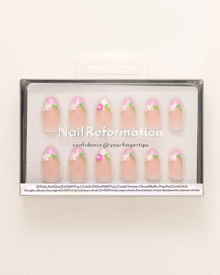 A touch of ooh la la. The Fleur de Magnolia press-ons bring effortless French charm to your fingertips! Inspired by the magnolia flower and the timeless elegance of a Parisian garden, these press-on nails combine soft pink bases with crisp white French tips, adorned with delicate floral accents and fresh green leaves. 