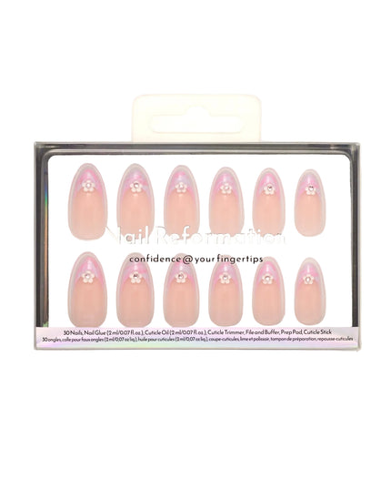 Like daydreams of Paris, Floral Reverie sweeps you away to a world of soft elegance and effortless charm. Blended pastel swirls on classic French tips mimic the watercolor skies over the Seine at dawn, while dainty floral accents add a touch of je ne sais quoi. The medium almond shape offers a refined silhouette, and the glossy finish captures the light like a Parisian café window on a sunny morning.