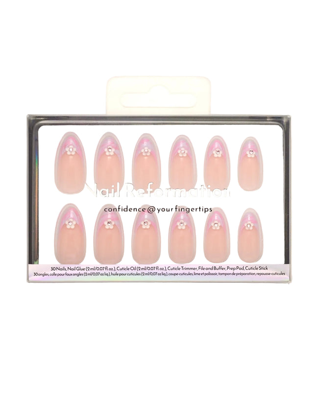 Like daydreams of Paris, Floral Reverie sweeps you away to a world of soft elegance and effortless charm. Blended pastel swirls on classic French tips mimic the watercolor skies over the Seine at dawn, while dainty floral accents add a touch of je ne sais quoi. The medium almond shape offers a refined silhouette, and the glossy finish captures the light like a Parisian café window on a sunny morning.